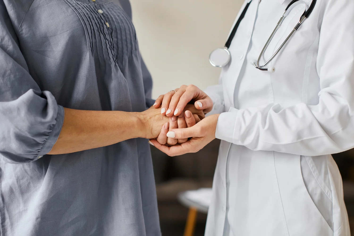 A doctor warmly speaking with a patient